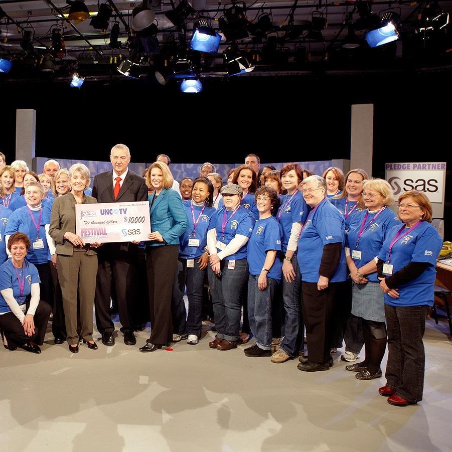Goodnights holding donation check