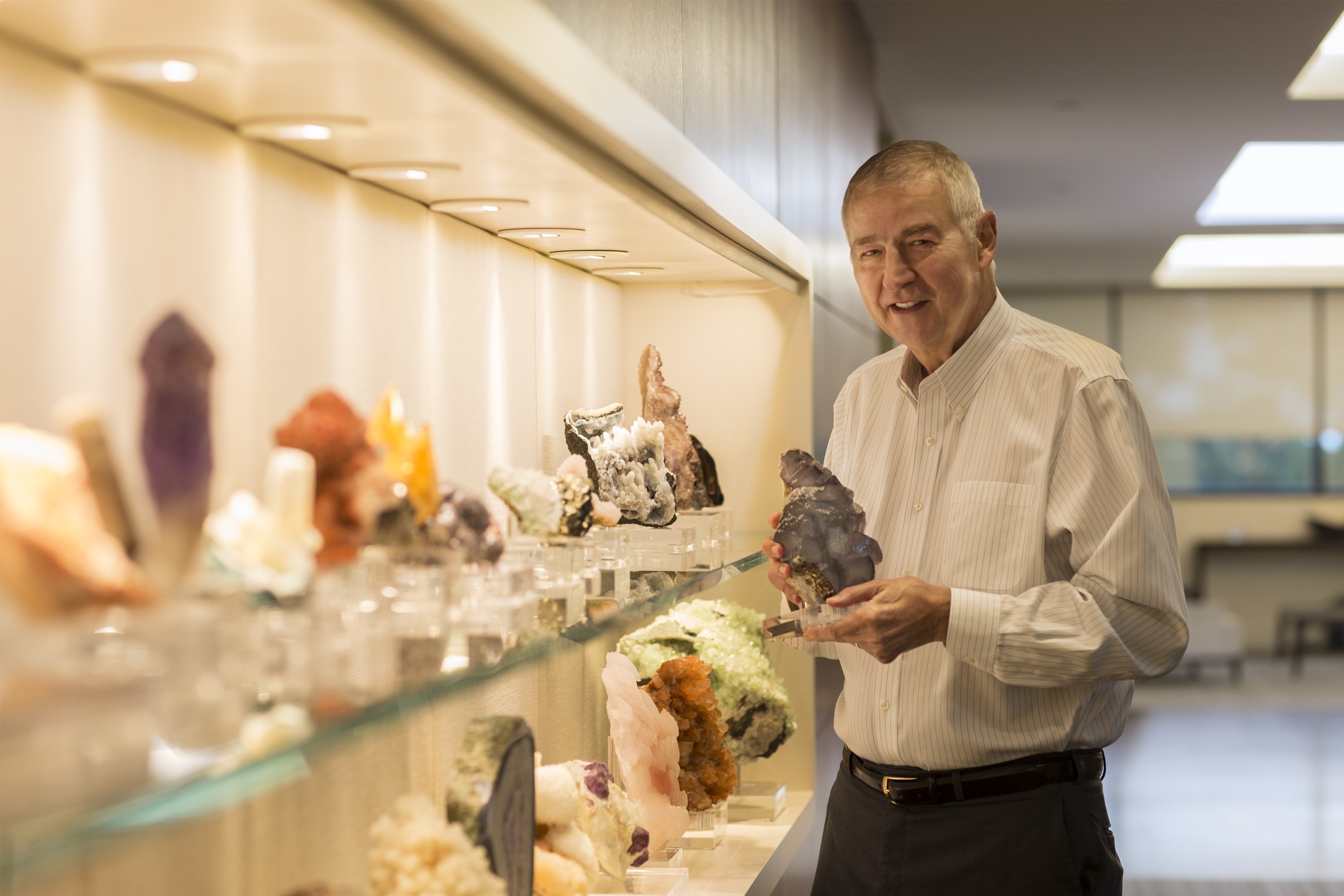 Dr Jim Goodnight showing geological collection