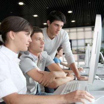  Group of students working together on computer
