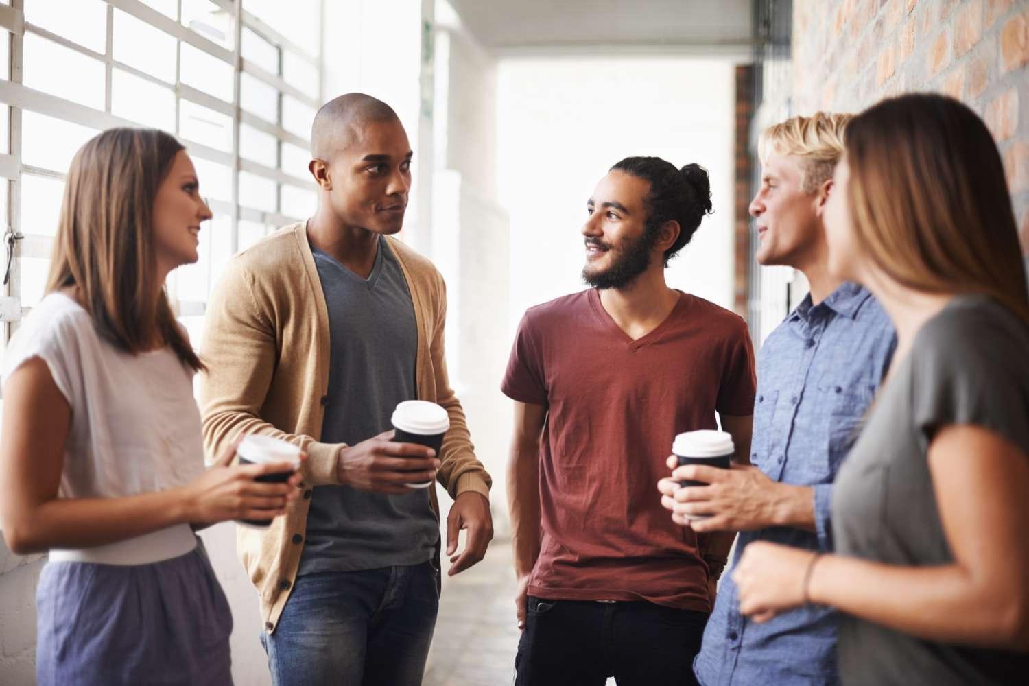 Diverse group of colleagues getting coffee