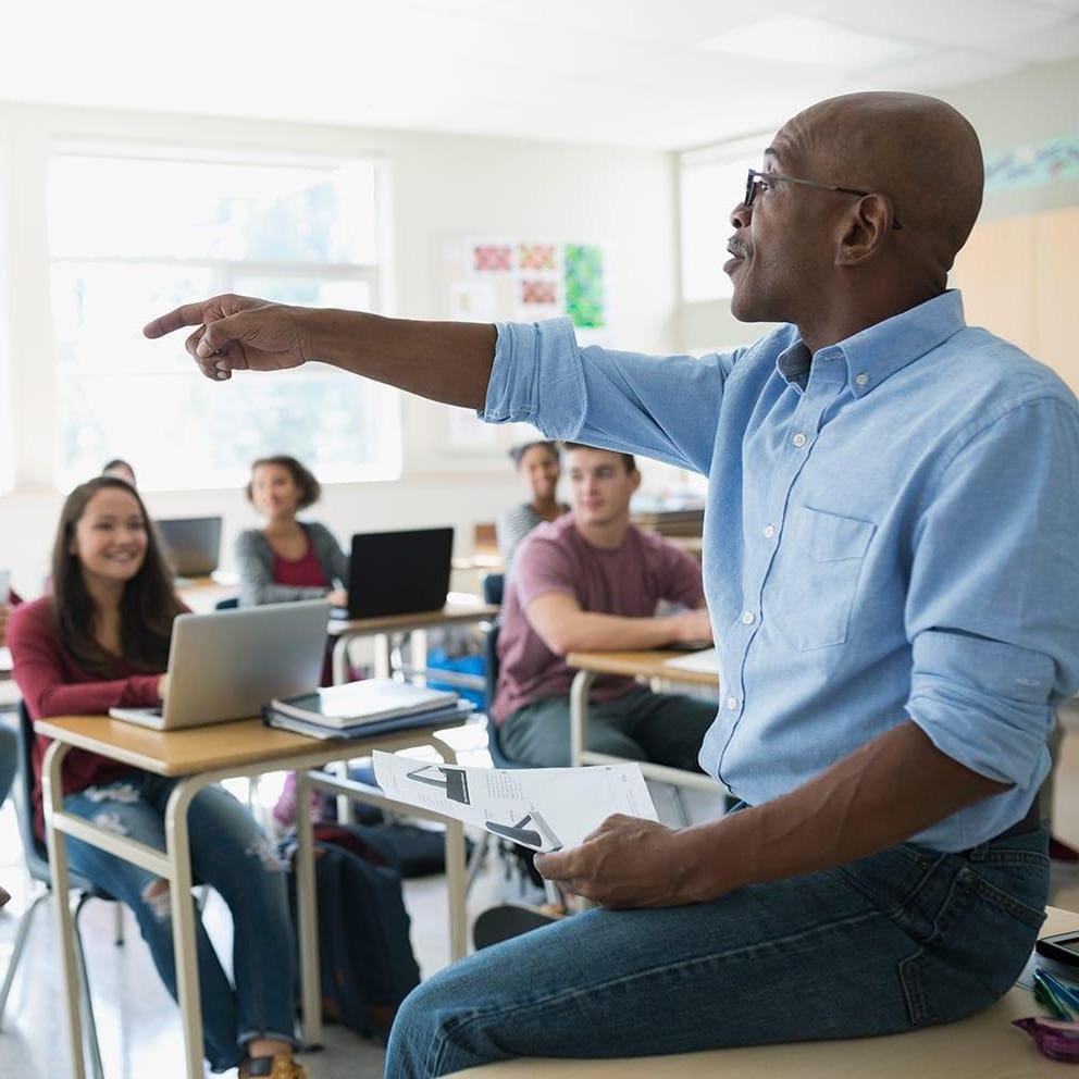 teacher asks questions in classroom