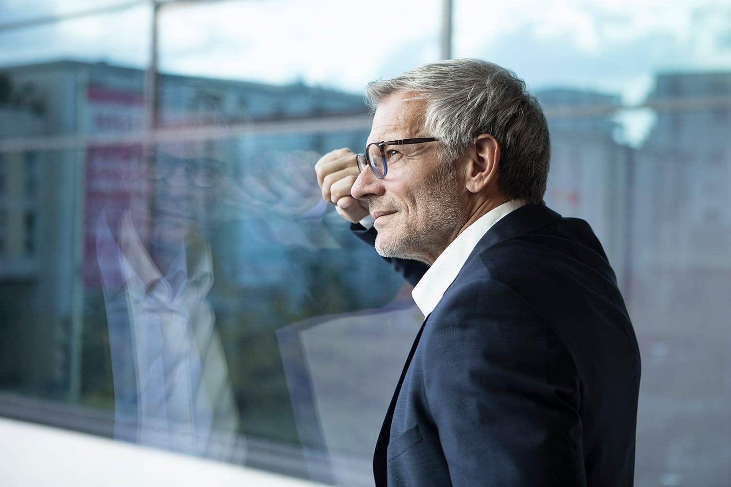 Businessman looking out of window