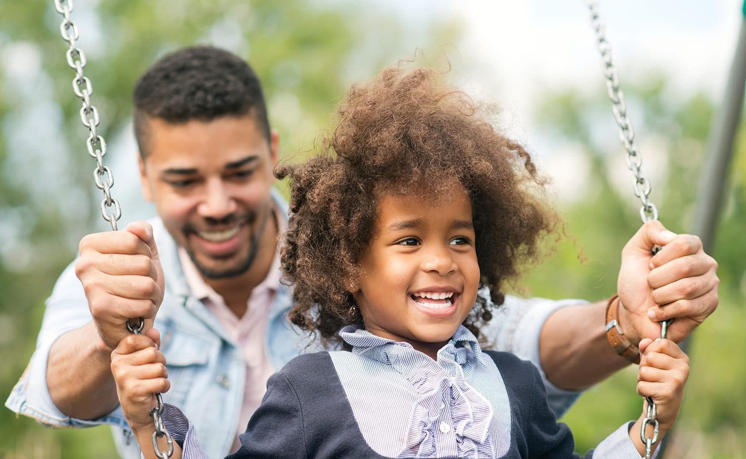 Father and daughter having fun at the park