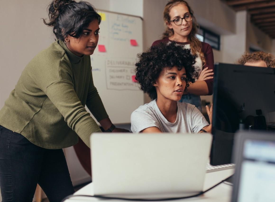 Women working on computer together