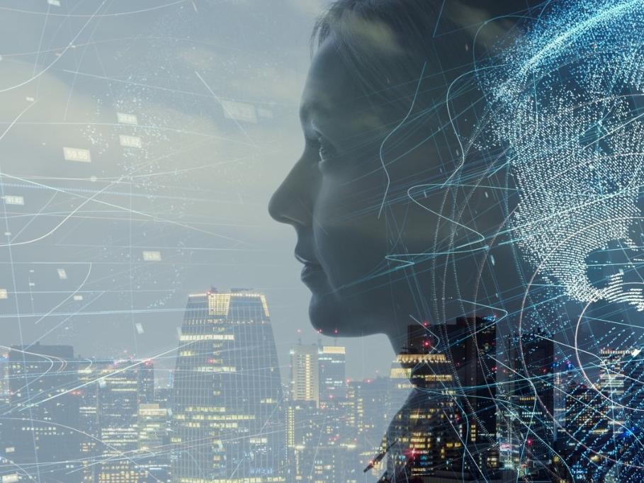 Closeup side view of woman's face with cityscape and data points swirling around her