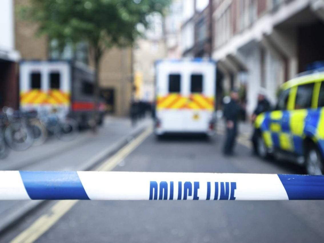 Street shot of police barricade at crime scene