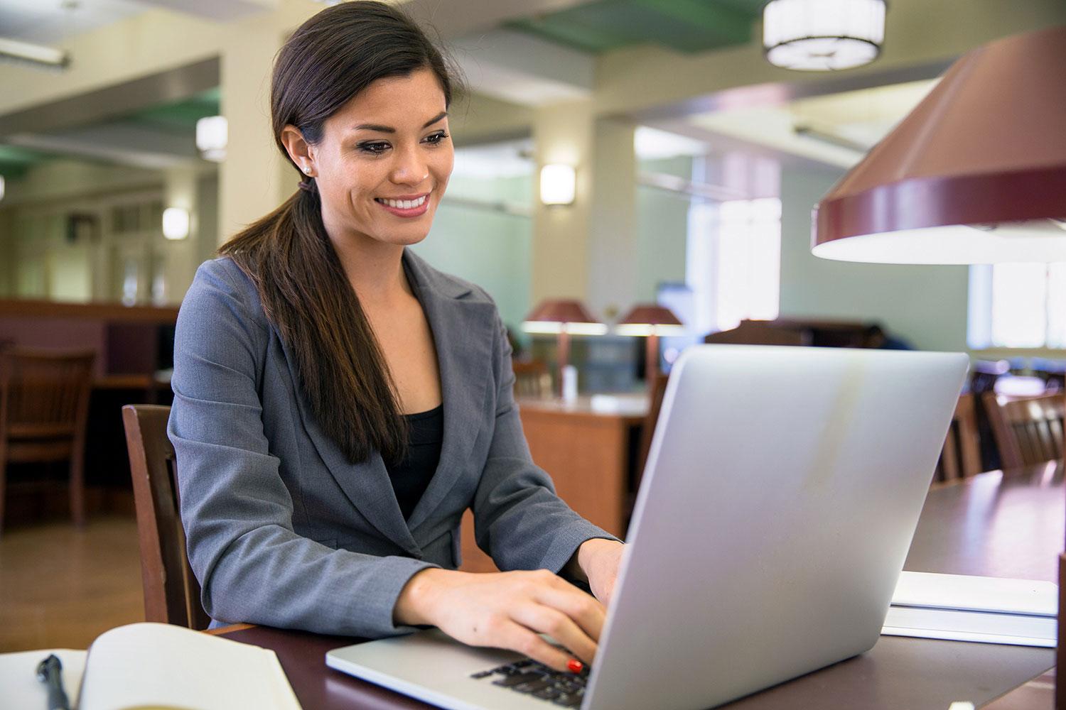 Woman smiling at computer