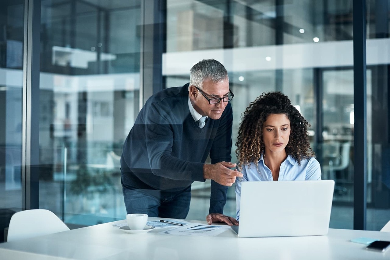 SAS Trust Center woman and older man in a office working together