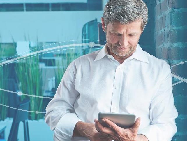 Man looking at tablet