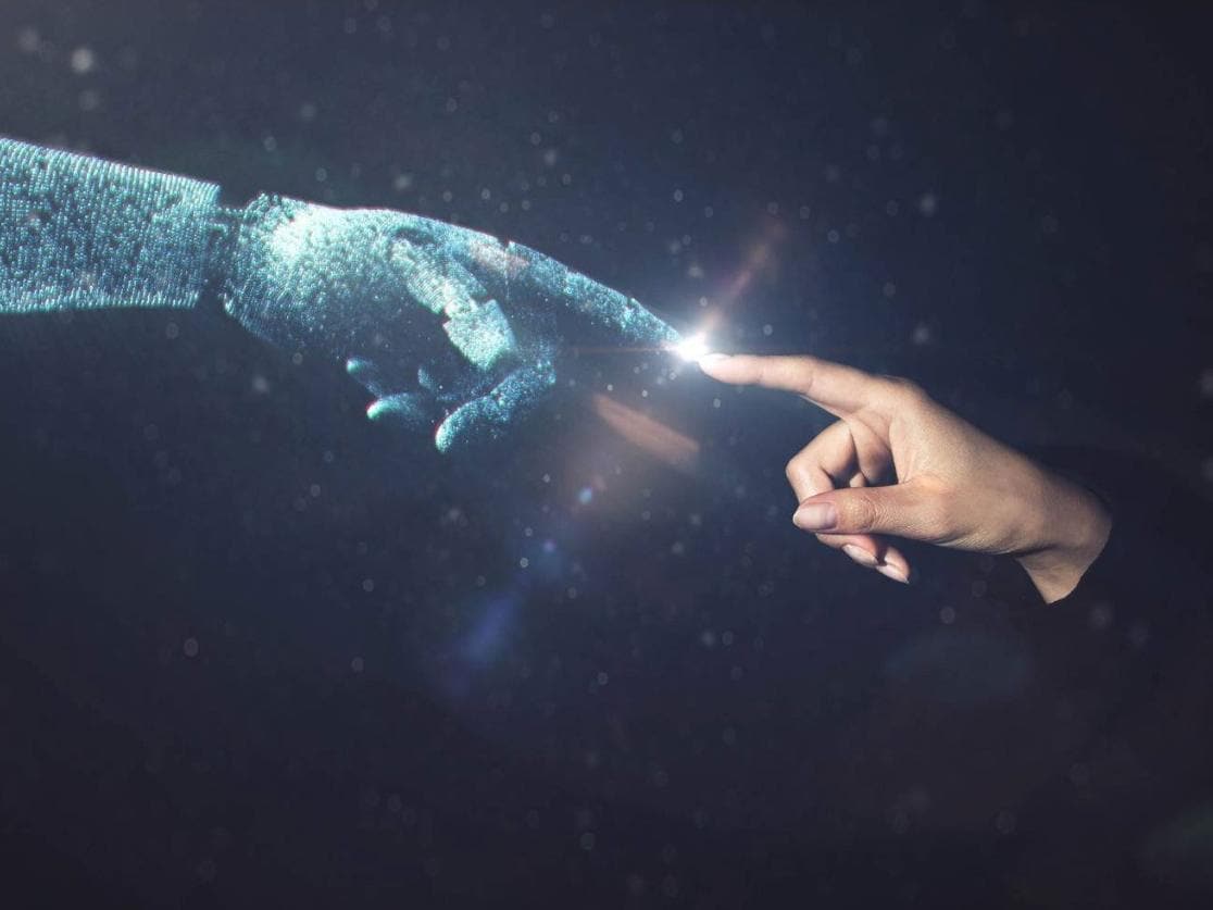 AI robotic hand touching human hand