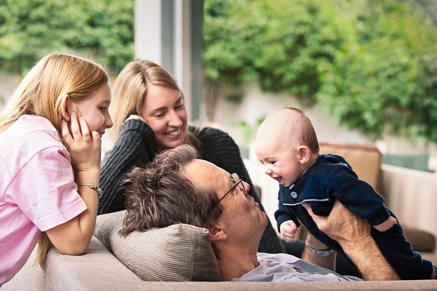 Family with father holding baby