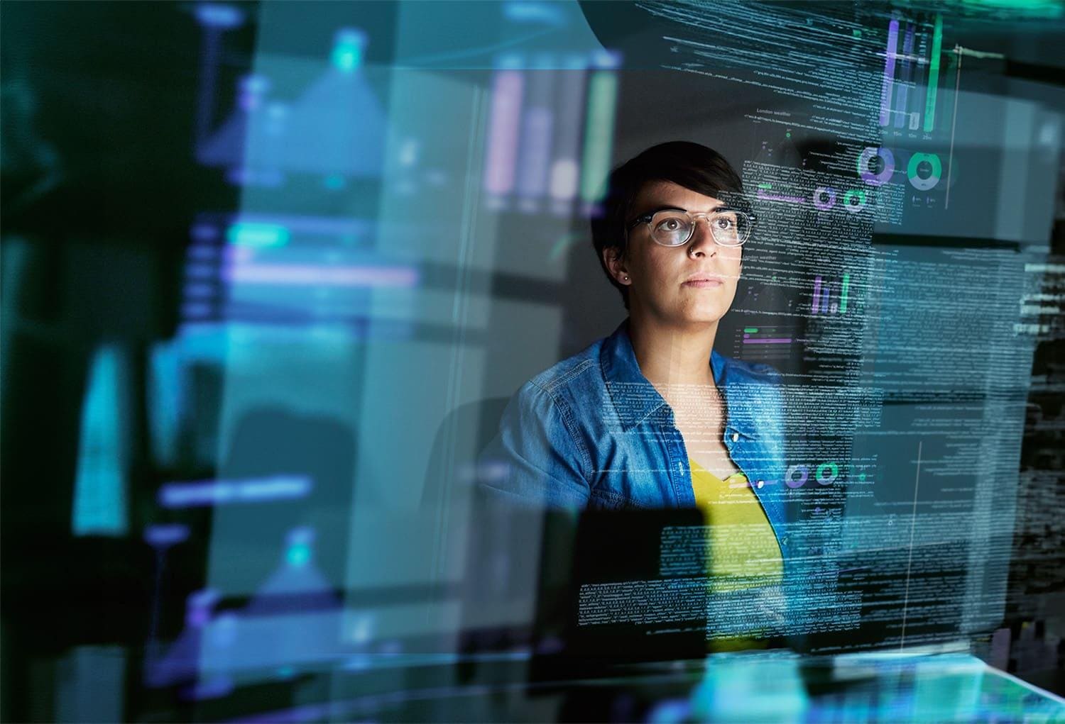 Woman working with data on a large screen