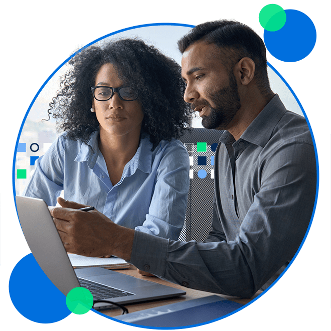 Male and female coworkers having discussion over laptop